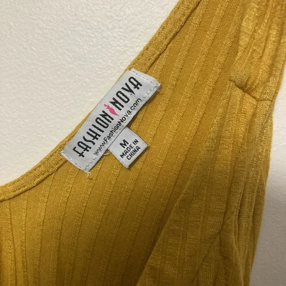 This mustard yellow bodysuit from fashion nova is a size M AU and is detachable - Picture 3 of 4